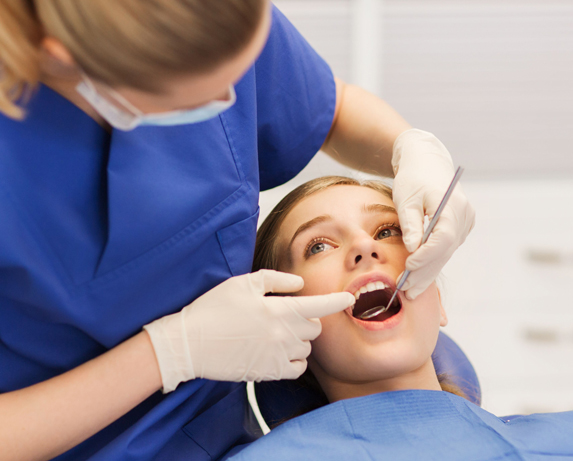 young girl getting a dental checkup