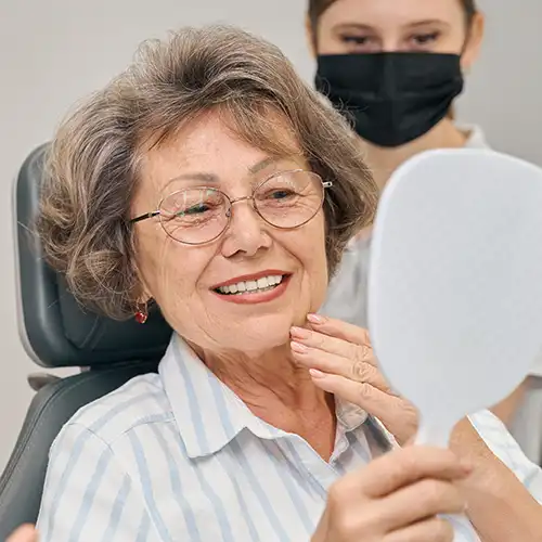 Older woman seeing veneers for the first time