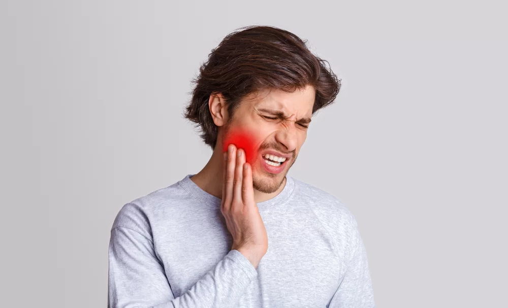 Man with sore tooth