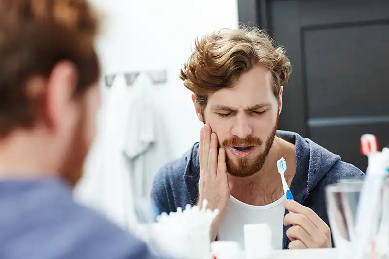 Tooth pain while brushing teeth
