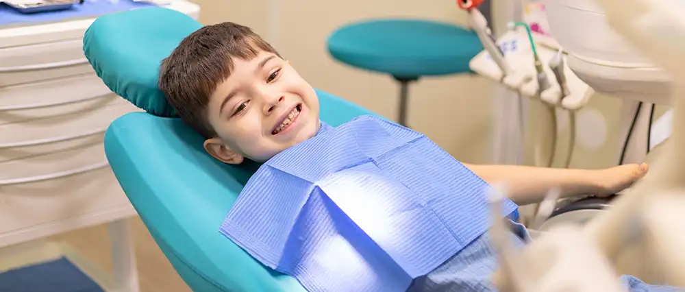 young boy getting fluoride treatment