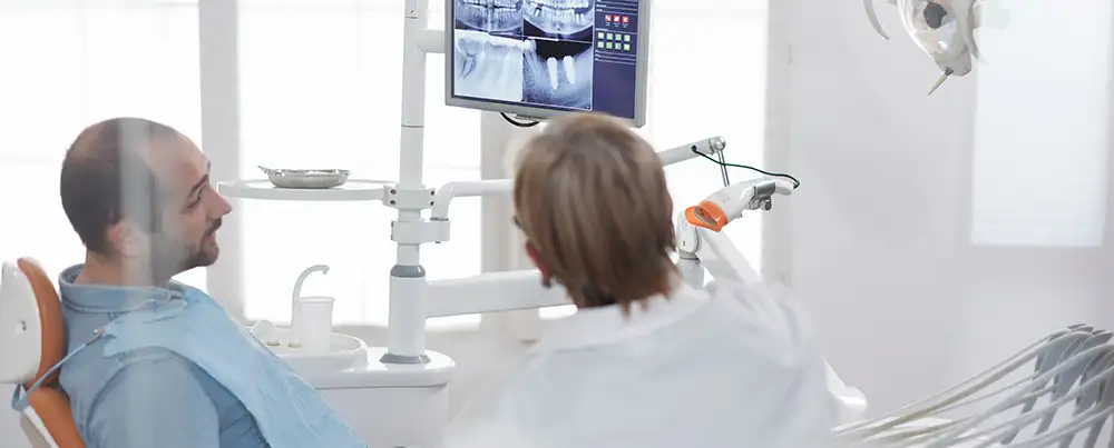 man seeing dentist about gum disease
