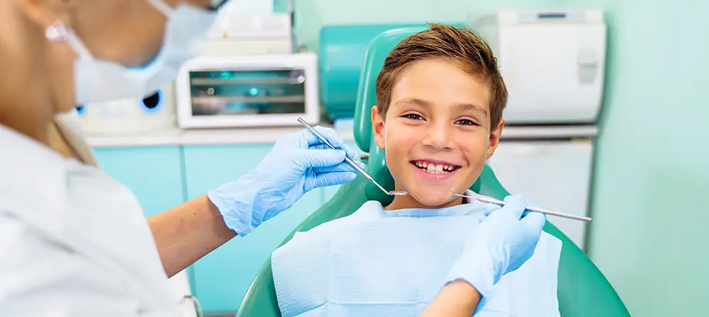 Kid getting fluoride treatments