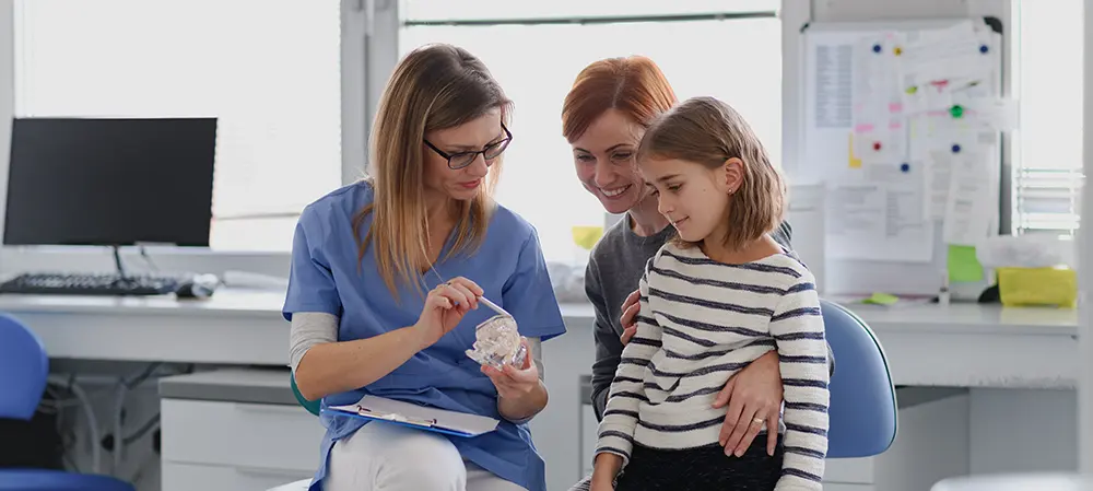 Mom and daughter visiting family dentist