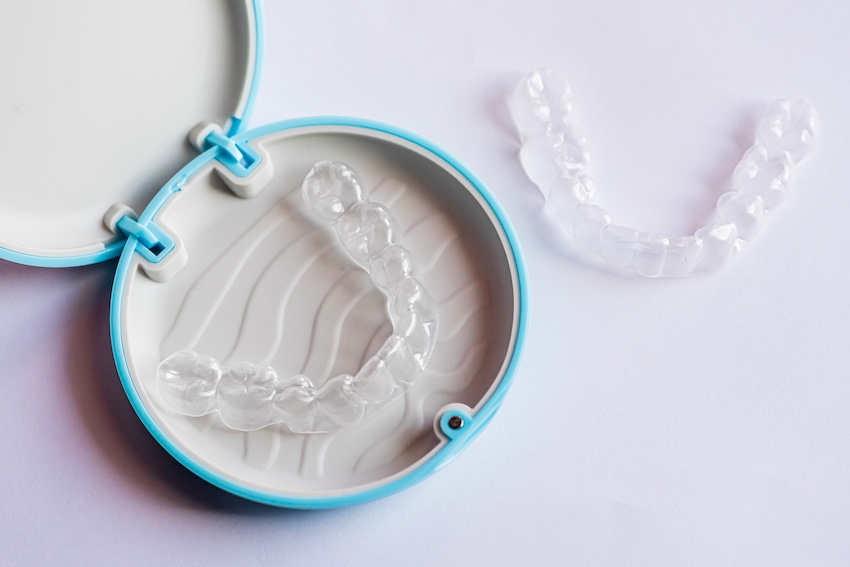 A dental model is showing the tooth structure with Invisalign® clear aligners for orthodontic planning at The Foleck Center in Virginia.