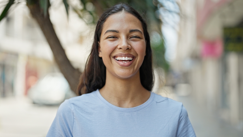 African american woman smiling confident standing at street