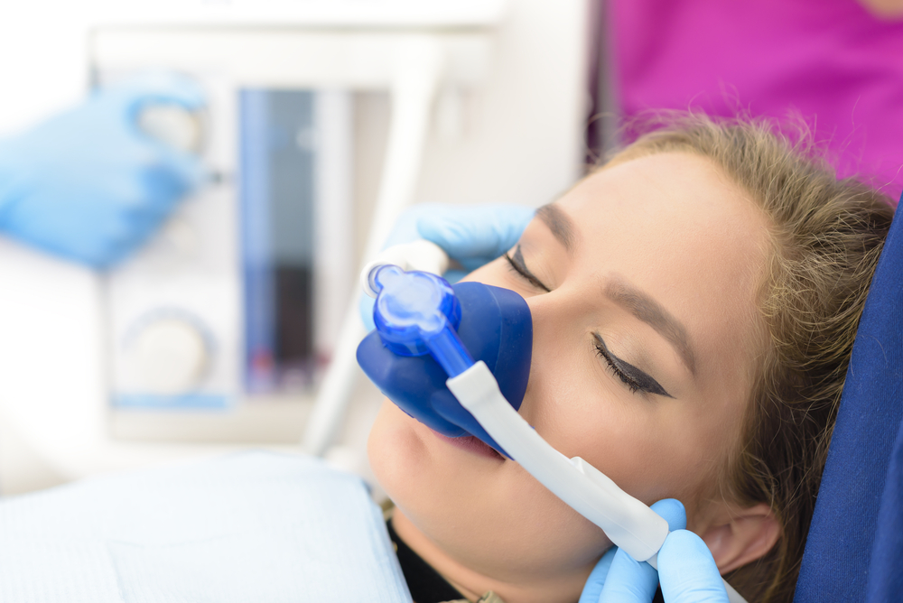 Woman relaxing comfortably during inhalation sedation at a Norfolk dental office 