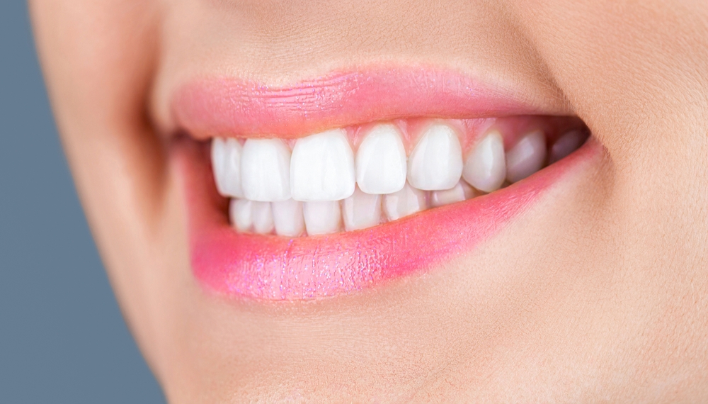 Close-up of a bright, white smile with straight teeth 