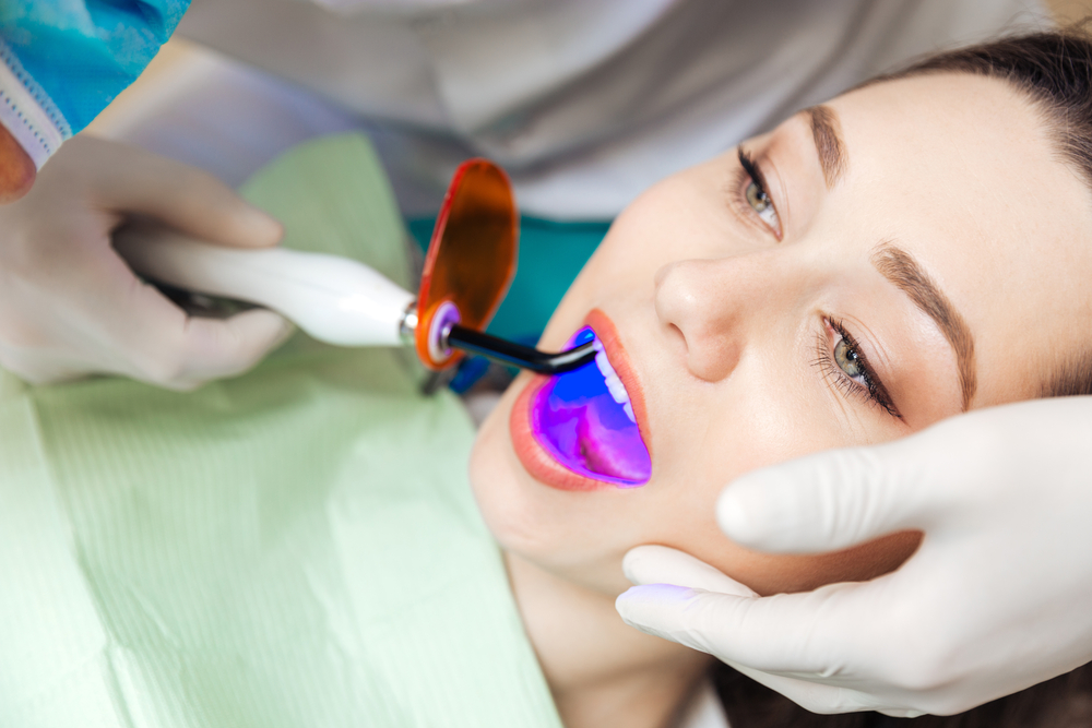 Close-up portrait of a female patient getting a bleach treatment in clinic