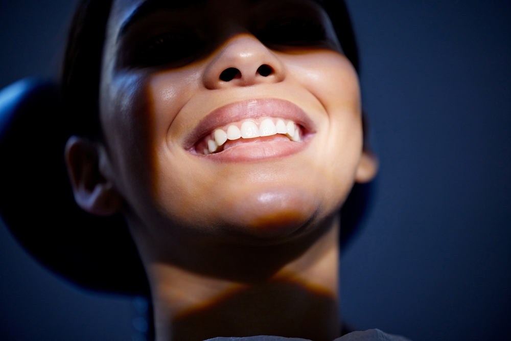 Mouth, smile and teeth with woman at dentist for oral hygiene or dental care checkup closeup. Appointment, healthcare and medical with happy patient in chair at clinic for cleaning, consult or exam