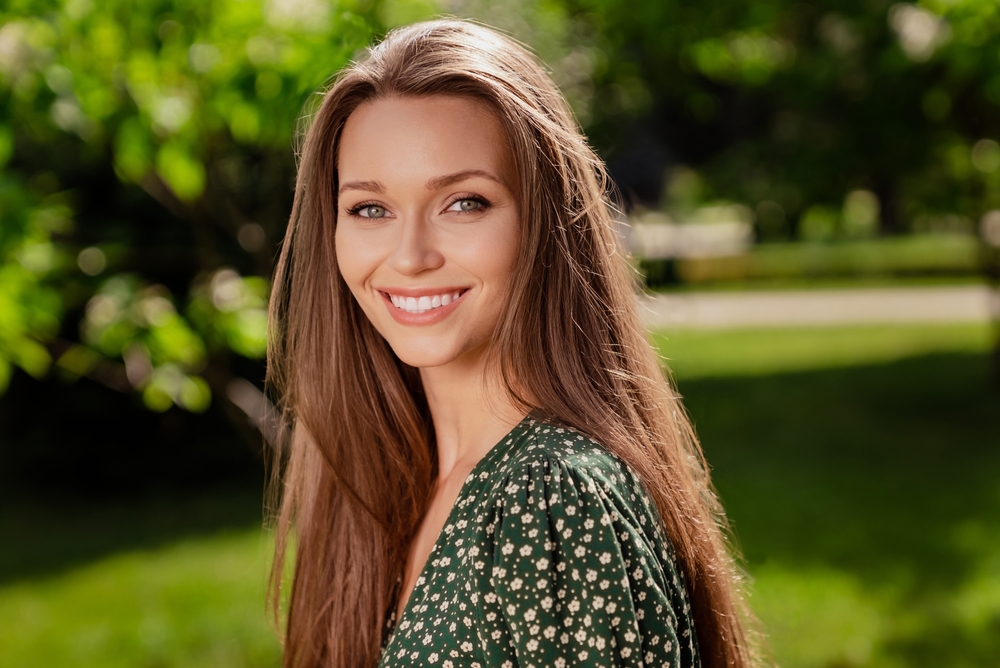 Photo of cheerful nice lady shiny white smile look camera enjoy day wear green dress nature park garden outdoors