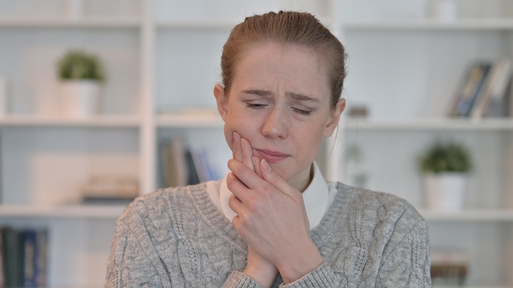 Portrait of Woman having Toothache