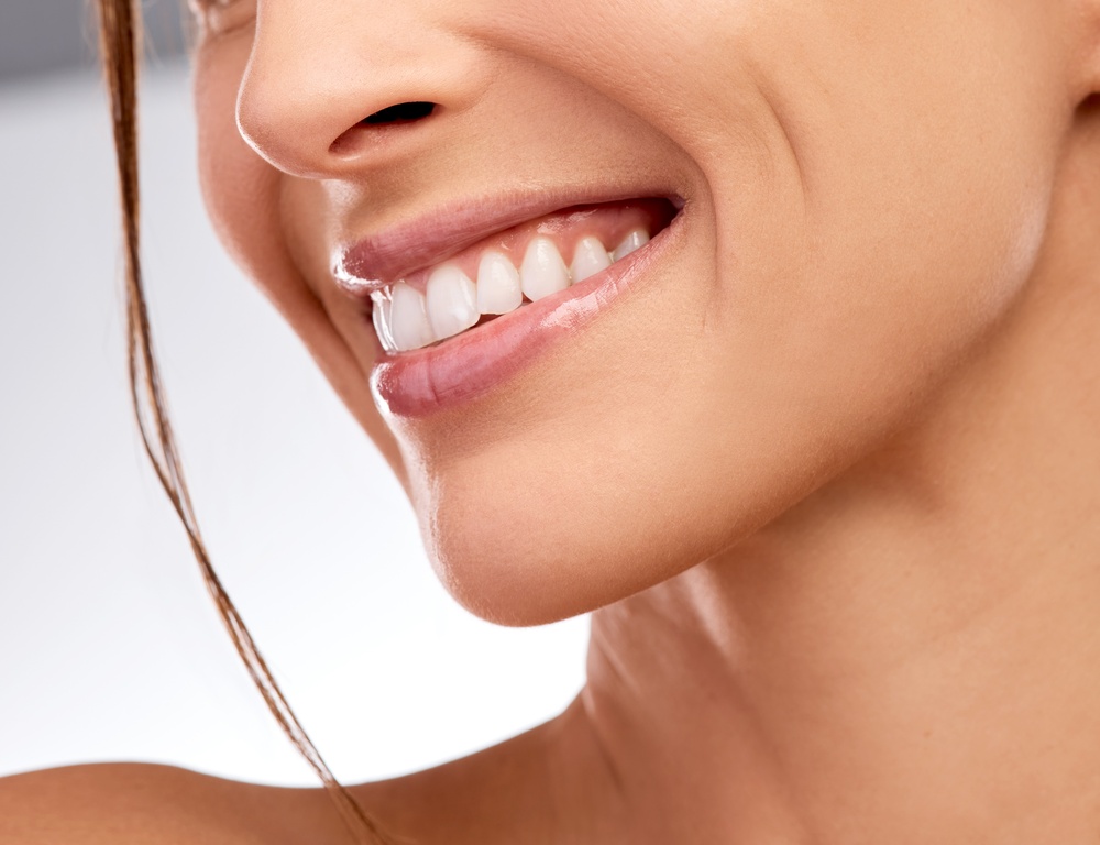 Smile, woman and dental with mouth in studio for hygiene, teeth whitening and orthodontic results.