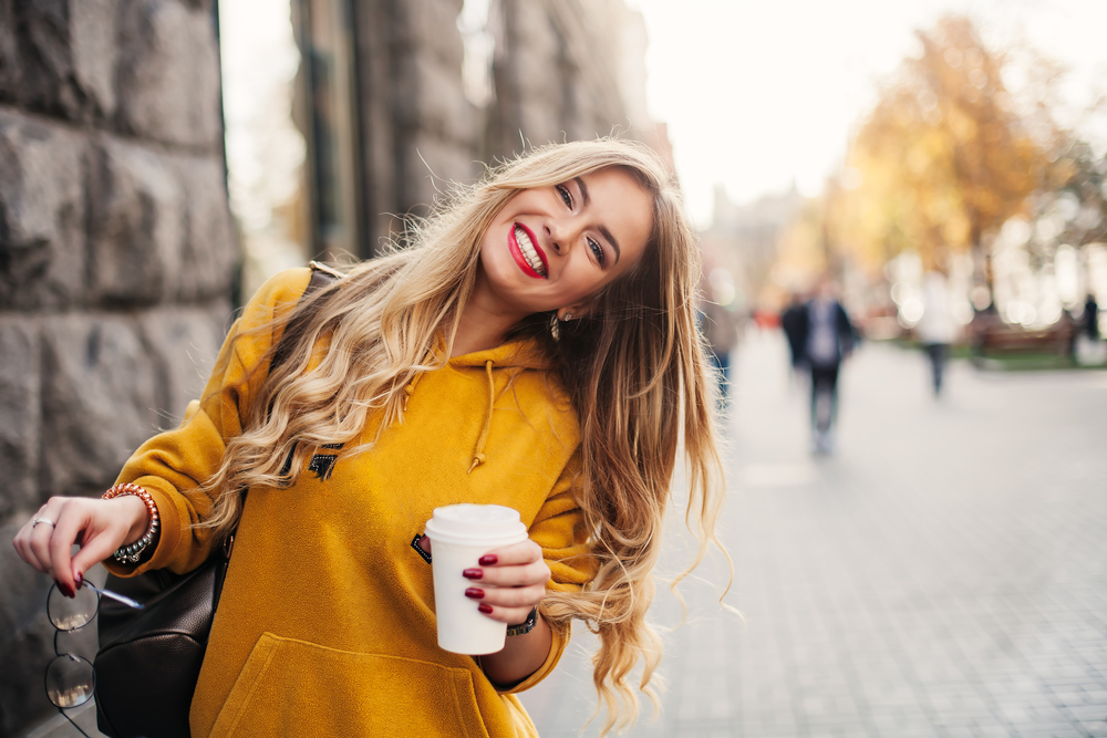 Woman with a bright smile outdoors in the Hampton community 