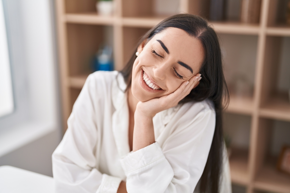 Woman with a relaxed, healthy smile indoors in the Hampton community 