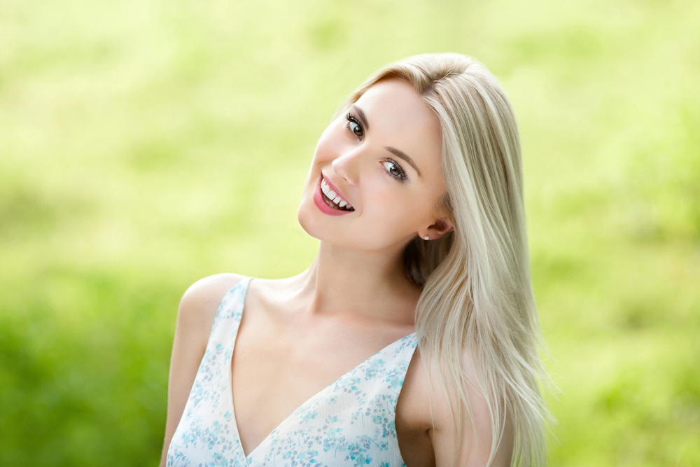 beautiful girl smiling on a sunny day
