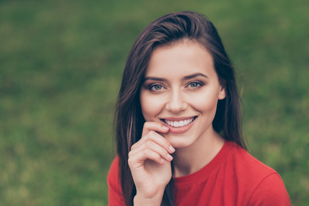 Woman with a healthy smile outdoors in the Hampton Roads area 