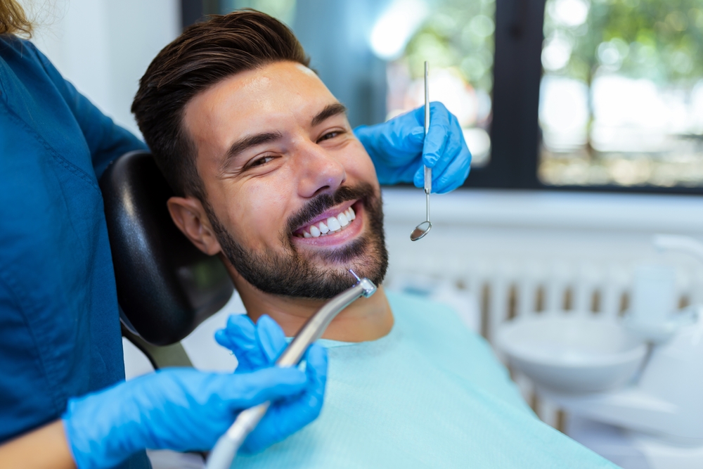 Patient smiling during a dental exam at our Virginia Beach, VA office 