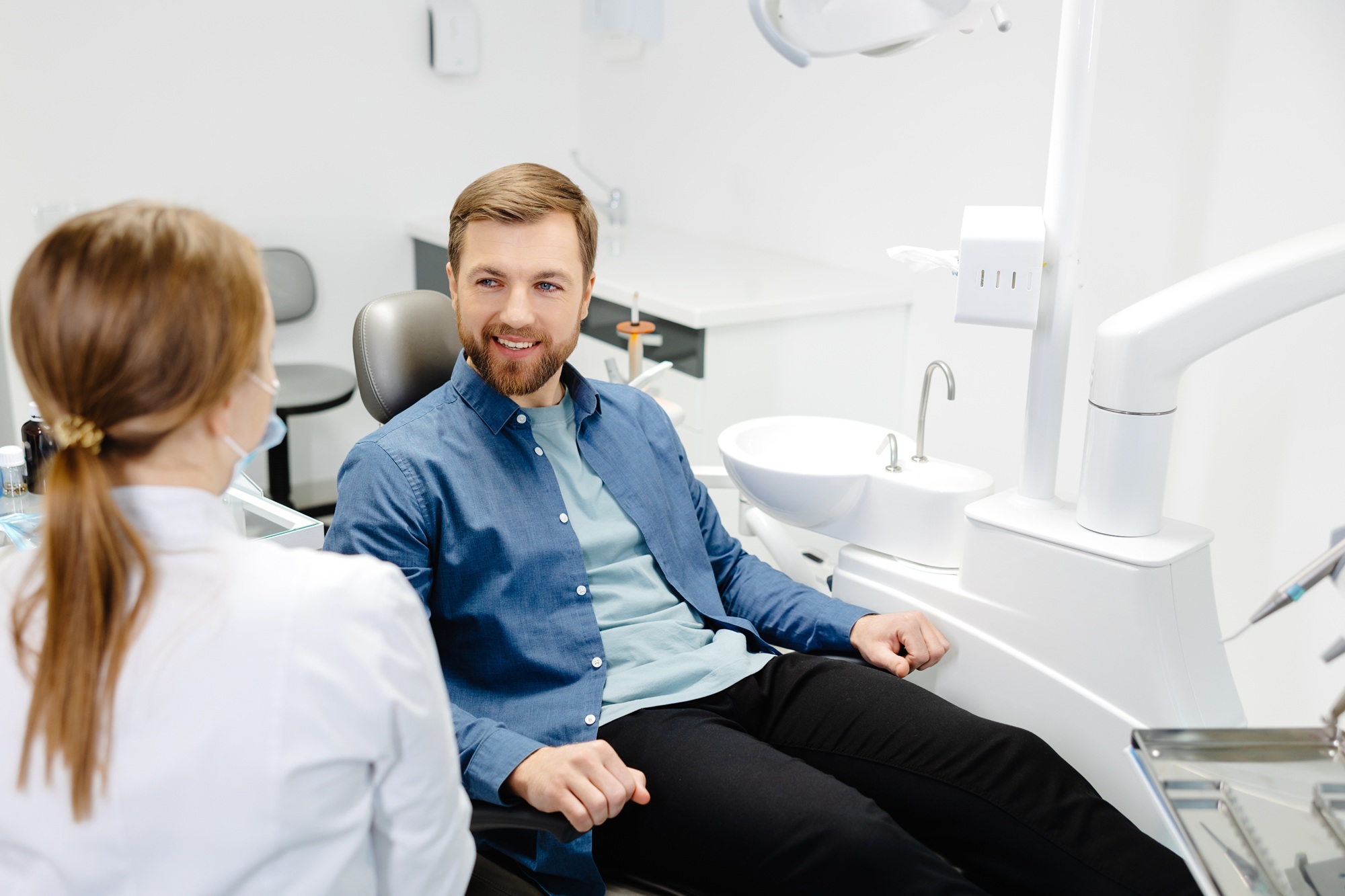 Dentist consulting with a patient in the treatment chair about restorative dentistry options at our Norfolk dental office 