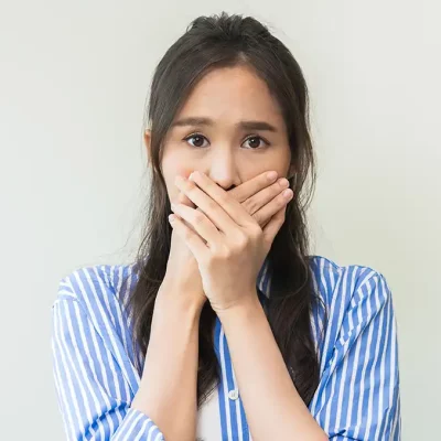 Woman with bad breath due to gum disease
