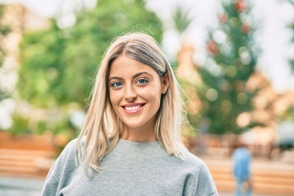 Woman with a healthy, bright smile outdoors in the Virginia Beach community 