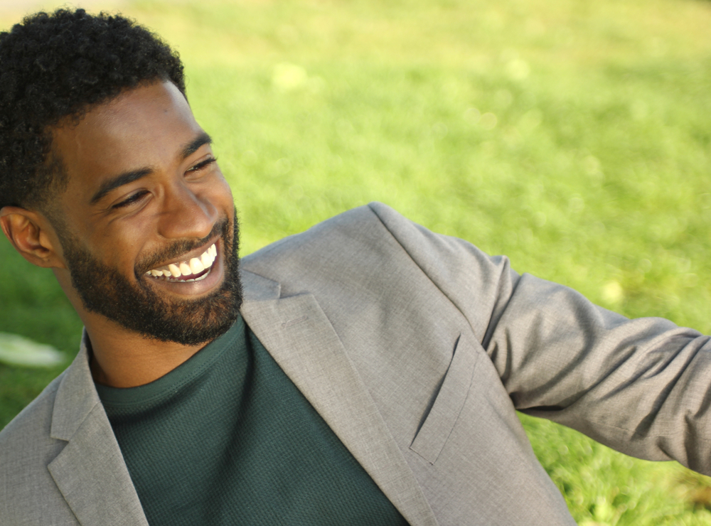 Man laughing outdoors in the Hampton Roads area 