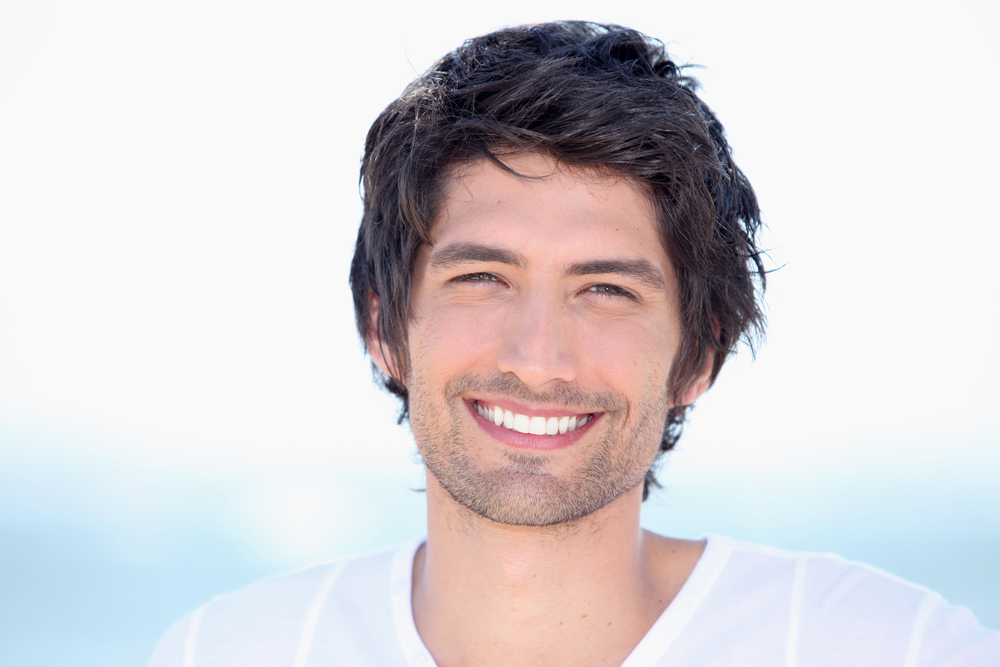 Young man with a healthy, bright smile in the Hampton community 