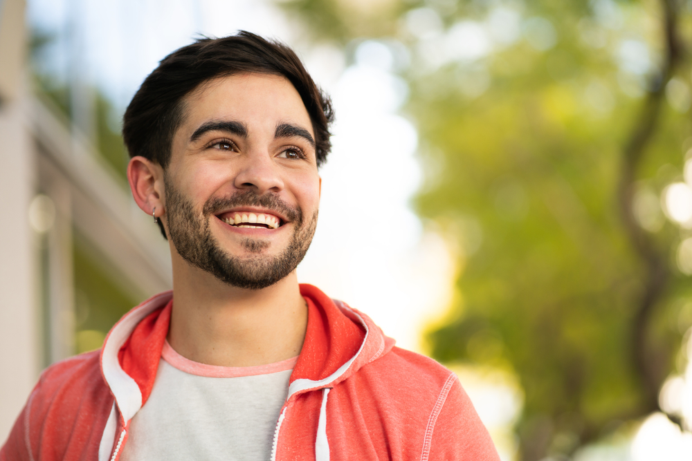 Man with a healthy, bright smile outdoors in the Virginia Beach community 